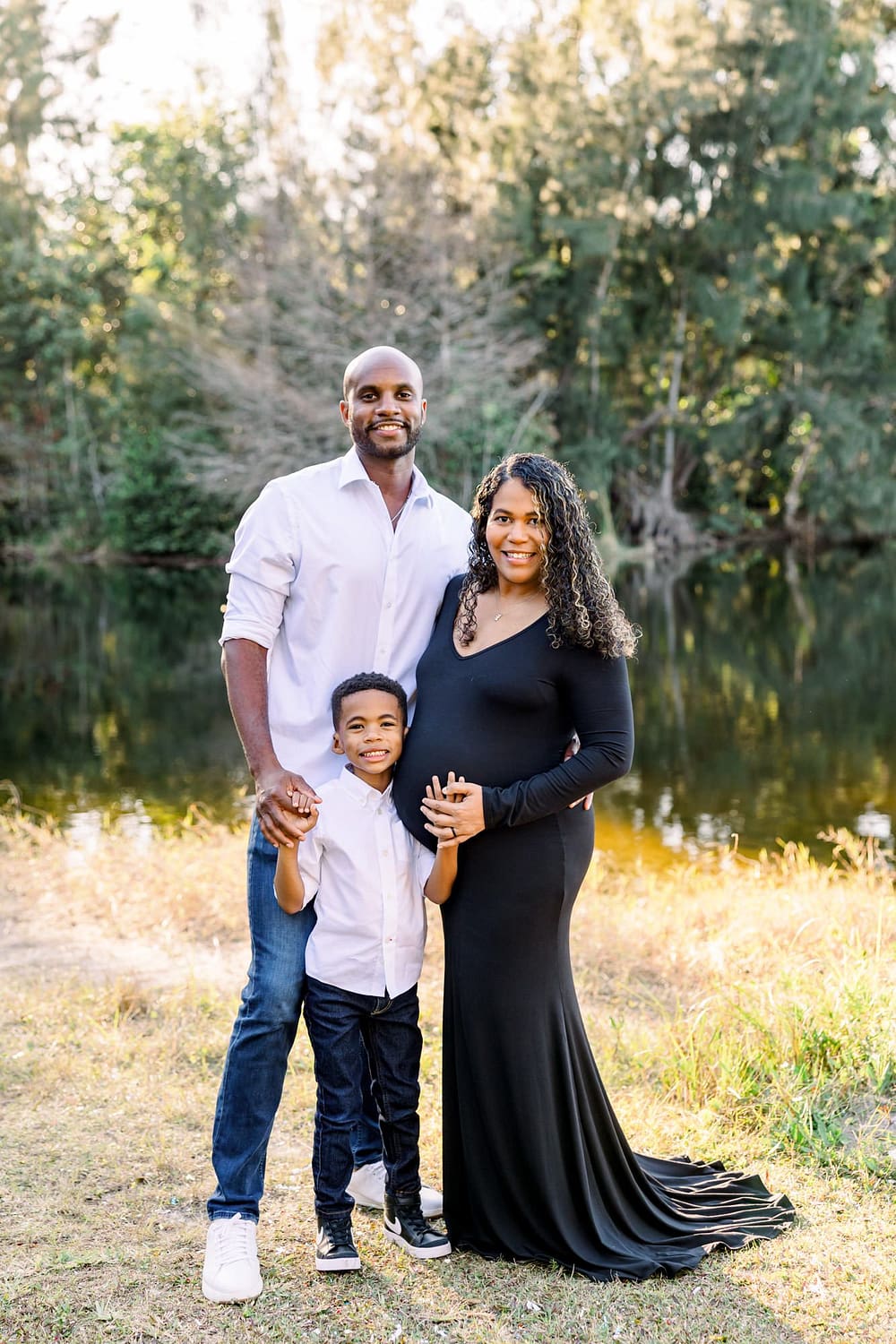 Family by water at Tree Tops Park in Florida