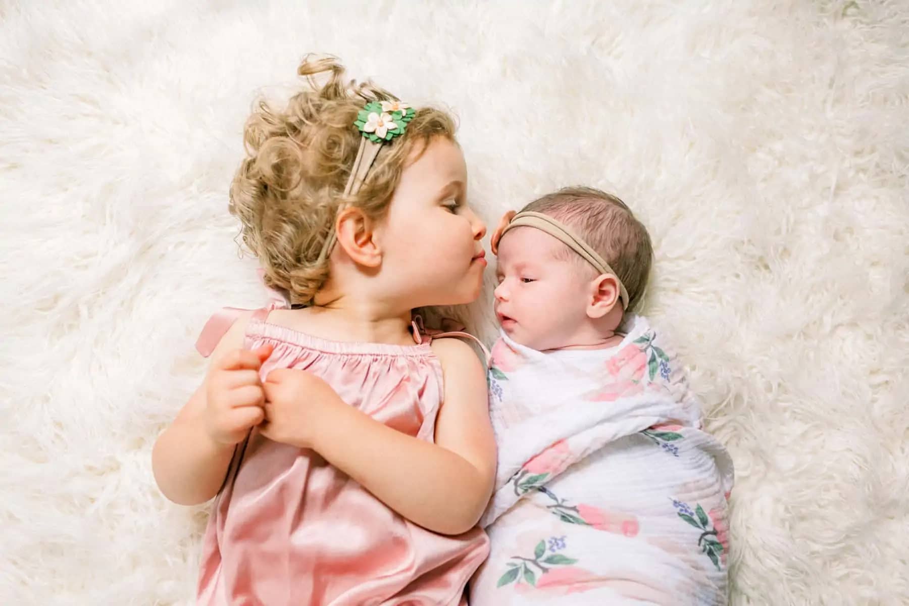 big sister kissing baby newborn photography south florida