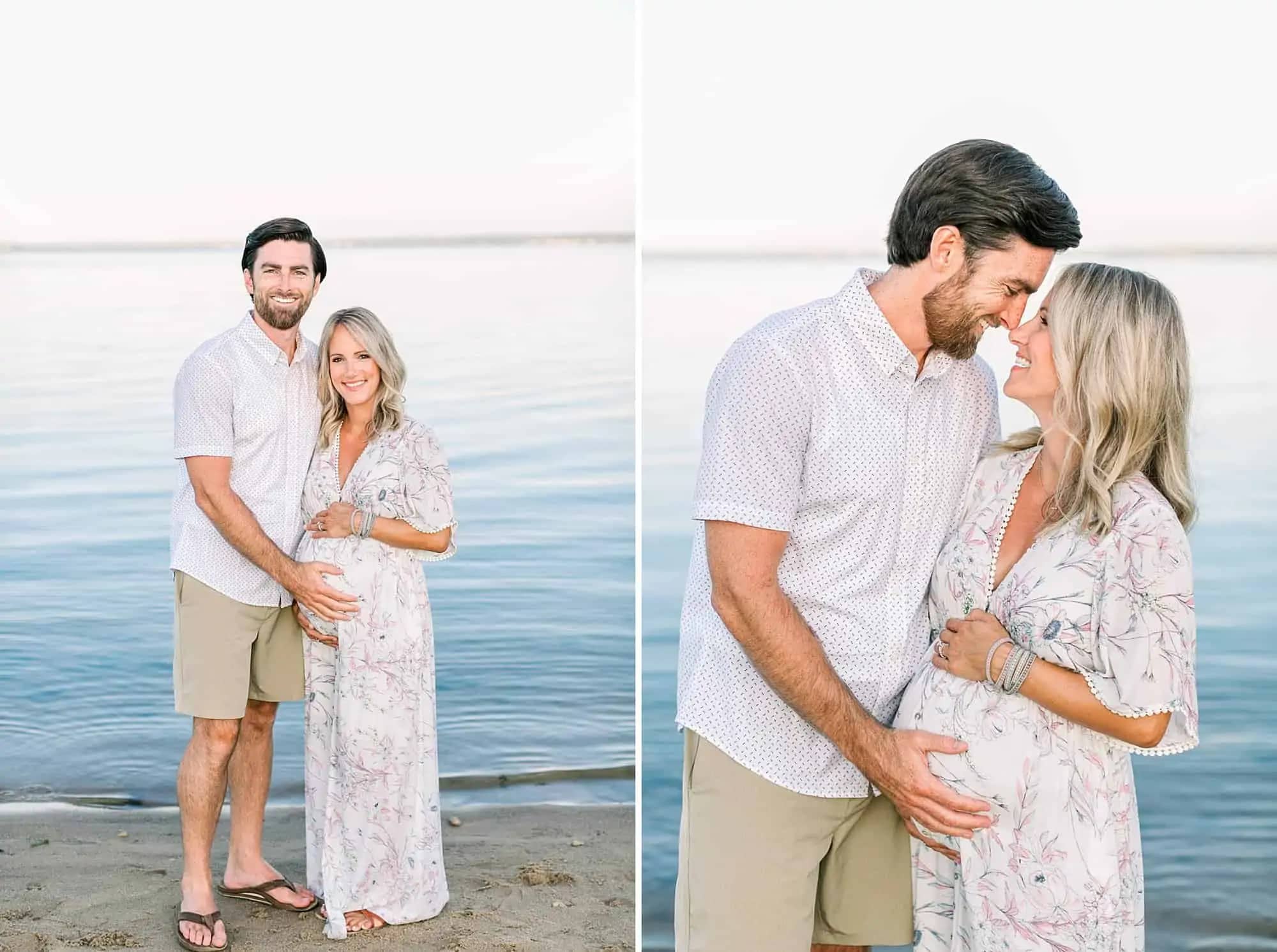 Pregnant couple smiling on the beach